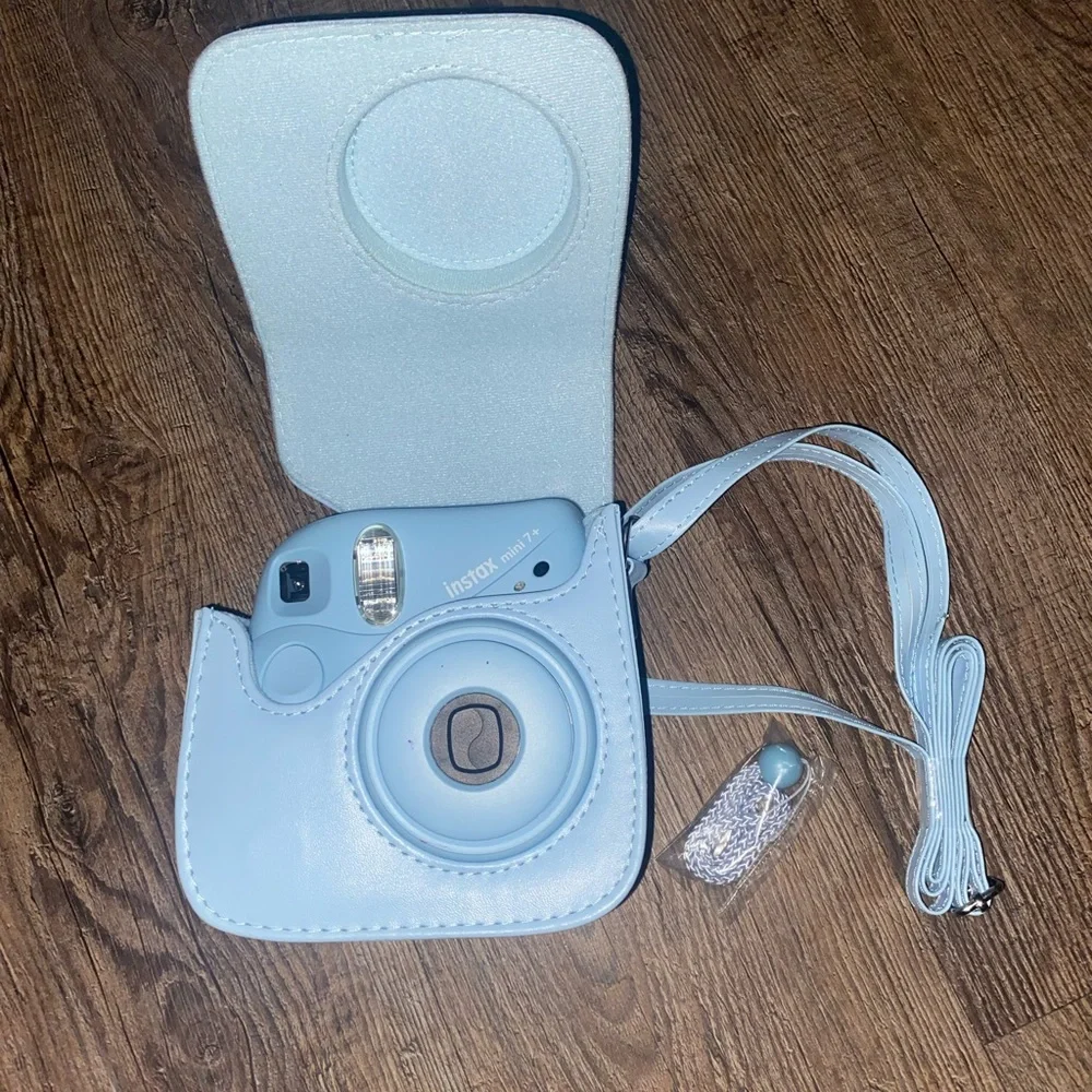 Baby Blue Polaroid Camera with photo book, film, and etc.